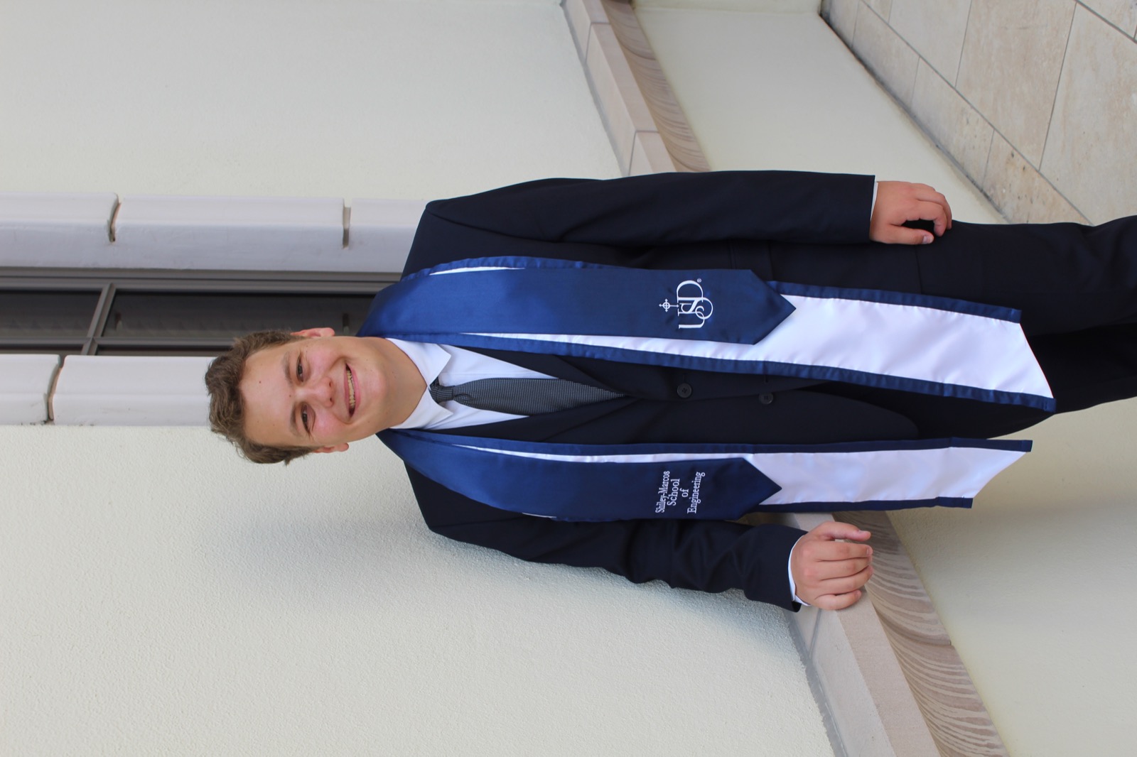 Andrew Albizati in graduation attire at the University of San Diego